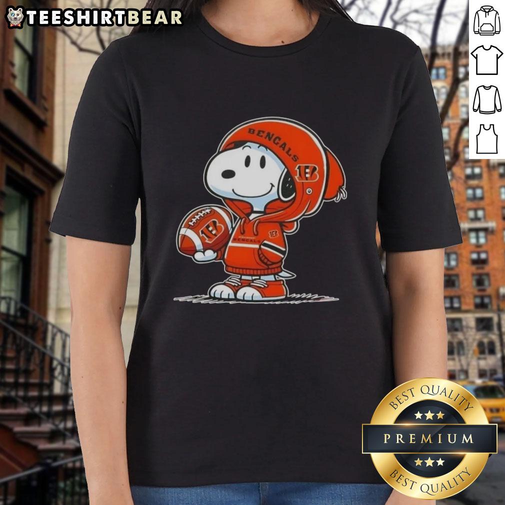 premium-peanuts-snoopy-wearing-hoodie-cincinnati-bengals-and-smilling-at-fans-ladies-tee Premium Peanuts Snoopy in a Cincinnati Bengals hoodie, smiling at fans on a ladies tee shirt.