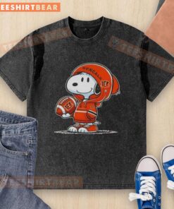 Alt Text: Snoopy wearing a Cincinnati Bengals hoodie smiles at fans in a premium peanuts washed t-shirt.
