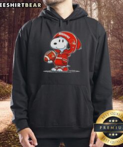 Premium Peanuts Snoopy wearing a Cleveland Browns hoodie, smiling at fans, showcasing team spirit and cuteness.