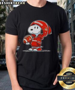 Alt Text: Premium Peanuts Snoopy in a Cleveland Browns hoodie smiling at fans on a fun T-shirt design.
