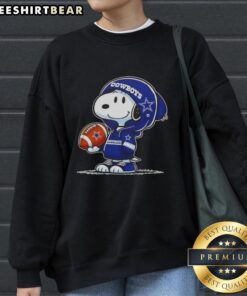 Alt Text: Snoopy in a Dallas Cowboys hoodie smiles at fans on a premium peanuts sweatshirt, showcasing playful team spirit.