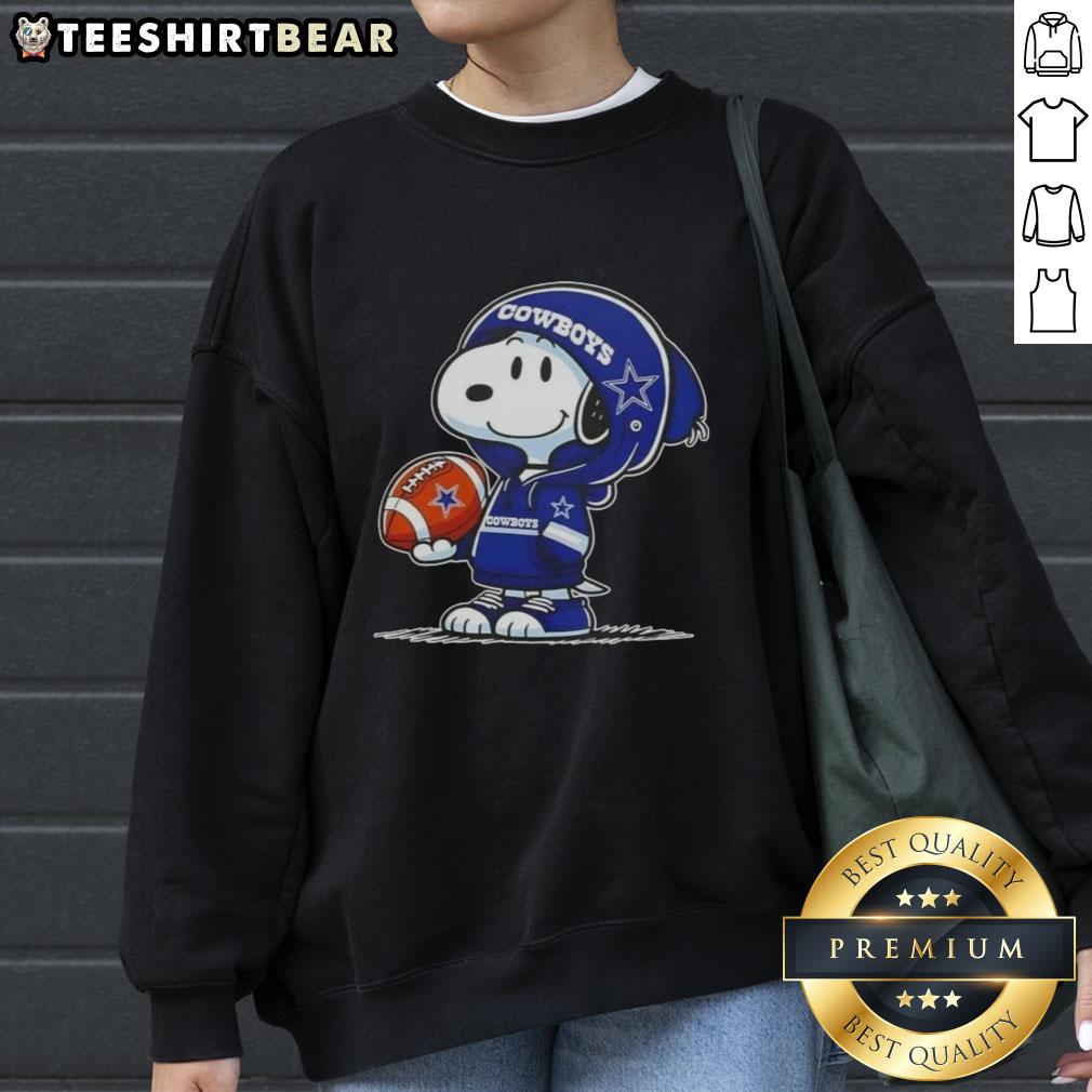 premium-peanuts-snoopy-wearing-hoodie-dallas-cowboys-and-smilling-at-fans-sweatshirt Alt Text: Snoopy in a Dallas Cowboys hoodie smiles at fans on a premium peanuts sweatshirt, showcasing playful team spirit.