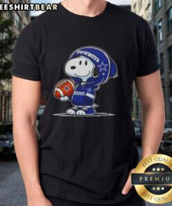 Alt Text: Premium Peanuts Snoopy in a hoodie smiles at fans on a Dallas Cowboys T-shirt, showcasing team spirit and fun.