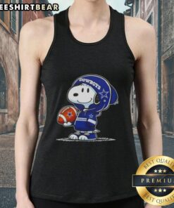 Premium Peanuts Snoopy in a hoodie smiles at fans on a Dallas Cowboys tank top, showcasing playful team spirit.