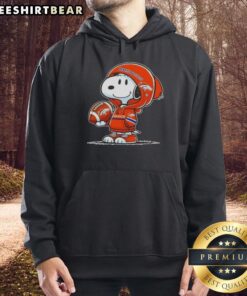 Alt Text: Snoopy wearing a Denver Broncos hoodie, smiling at fans, featuring premium peanuts branding, and showcasing team spirit.