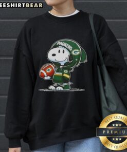 Premium Peanuts Snoopy in a Green Bay Packers hoodie smiles at fans, showcasing a fun sweatshirt design.
