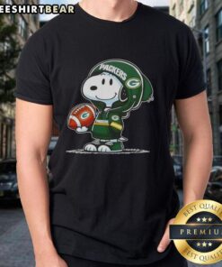 Alt Text: Premium Peanuts Snoopy in a Green Bay Packers hoodie smiles at fans on a fun t-shirt design.