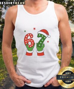 Alt Text: Santa Claus hands holding a festive tank top featuring 'Pretty Christmas 67 Six Seven' design, perfect for holiday wear.