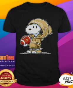 Alt Text: Pretty Peanuts Snoopy in a hoodie smiles at fans, showcasing New Orleans Saints spirit on a trendy T-shirt.