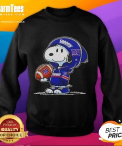 Snoopy in a New York Giants hoodie, smiling at fans, showcasing a stylish Pretty Peanuts sweatshirt.
