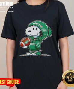Alt Text: Snoopy in a New York Jets hoodie smiles at fans on a ladies' tee featuring pretty peanuts design.