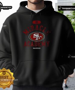 Pretty San Francisco 49ers NFL Miracle Academy Nahmias hoodie worn by a fan at a game, showcasing team spirit and style.