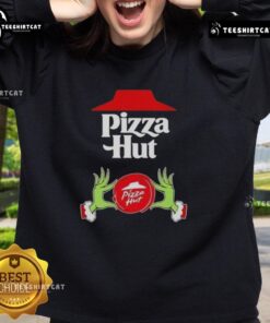 Top Grinch hands holding a pizza slice on a Merry Christmas Sweatshirt from Pizza Hut, perfect for festive celebrations.