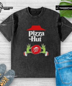 Top Grinch hands holding a pizza, wearing a Merry Christmas Pizza Hut washed t-shirt, festive holiday spirit.