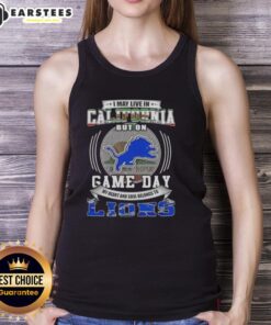 Alt Text: Stylish tank top saying 'I May Live In California But On Game Day Detroit Lions' perfect for football fans.