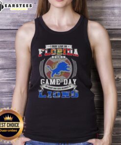 Trendy tank top featuring 'I May Live In Florida But On Game Day Detroit Lions Football' slogan, perfect for fans.