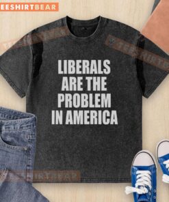 Top Liberals Are The Problem In America washed t-shirt displayed on a hanger, featuring bold text design.