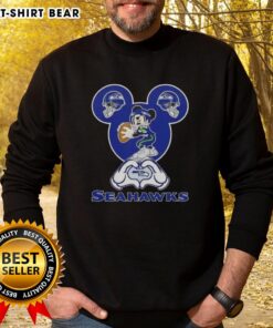Seattle Seahawks sweatshirt featuring top Mickey hands forming a heart, perfect for fans showing love for football.