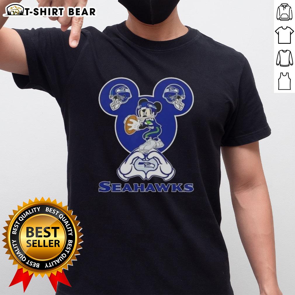 Top Mickey Hands Heart Love Seattle Seahawks Football T Shirt Top Mickey Hands Heart Love Seattle Seahawks Football T-Shirt design featuring playful Mickey Mouse hands in a heart shape.