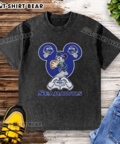 Alt Text: Top Mickey Hands heart love graphic on Seattle Seahawks football washed t-shirt for fans and casual wear.