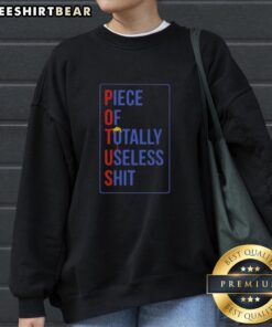 Donald Trump hair sweatshirt featuring 'Totally Useless Shit' design, perfect for political humor and satire lovers.
