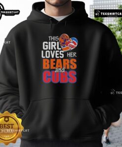 Girl wearing a Chicago sports hoodie, showing love for Bears and Cubs, smiling in a vibrant city backdrop.