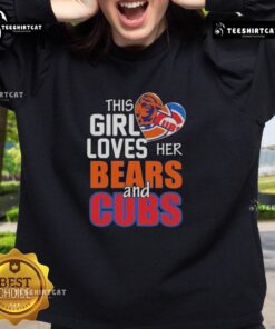 Girl in a Chicago sports sweatshirt, showcasing her love for the Bears and Cubs, smiling in a vibrant city setting.