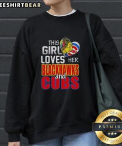 Girl in a Chicago sports sweatshirt, showcasing her love for Blackhawks and Cubs at a game in Chicago.