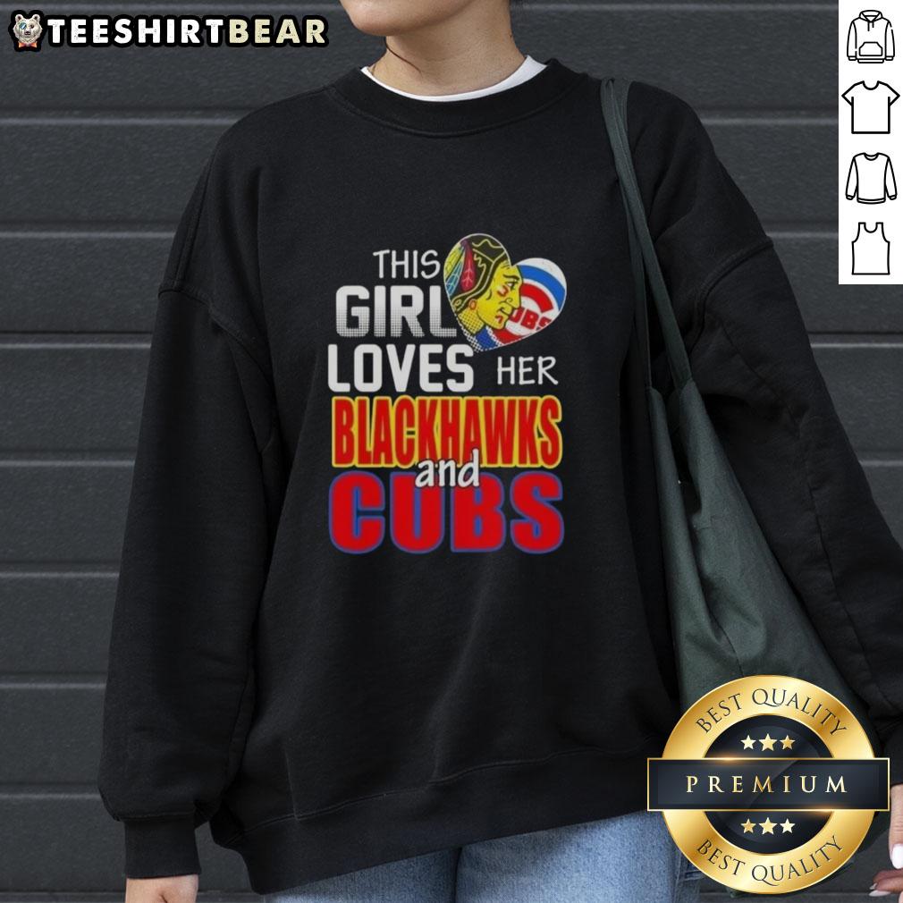 top-this-girl-loves-her-chicago-sports-blackhawks-and-cubs-sweatshirt Girl in a Chicago sports sweatshirt, showcasing her love for Blackhawks and Cubs at a game in Chicago.