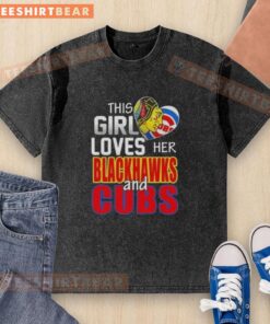 Alt Text: Girl wearing a washed black t-shirt showing love for Chicago sports, featuring Blackhawks and Cubs logos.