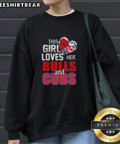 Alt Text: Girl wearing a Chicago sports sweatshirt, showcasing love for Bulls and Cubs, smiling in a vibrant urban setting.