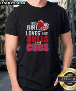 Girl wearing 'Top This' Chicago sports T-shirt, showing love for Bulls and Cubs, smiling in vibrant city setting.