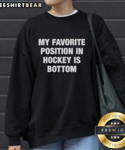 Top My Favorite Position in Hockey is Bottom sweatshirt featuring bold text on a cozy fabric, perfect for hockey fans.