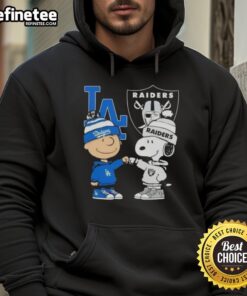 Alt Text: Awesome Charlie Brown fist bump with Snoopy in Los Angeles Dodgers and Raiders hoodie, showcasing city sports spirit.
