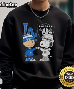 Awesome Charlie Brown fist bump with Snoopy on a Los Angeles sports sweatshirt featuring Dodgers and Raiders.