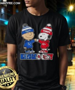 Alt Text: Awesome Charlie Brown fist bump with Snoopy on a Kansas City Sports Royals X Chiefs T-shirt design.