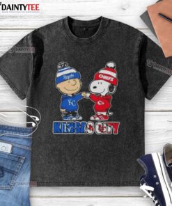Awesome Charlie Brown fist bump with Snoopy on a Kansas City Royals & Chiefs washed t-shirt design.