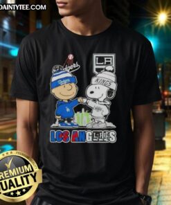 Awesome Charlie Brown fist bump with Snoopy, featuring Los Angeles skyline, Dodgers, and Kings on a trendy T-shirt.