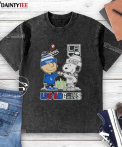 Alt Text: Awesome Charlie Brown fist bump with Snoopy, Los Angeles skyline, Dodgers and Kings logo on a washed t-shirt.