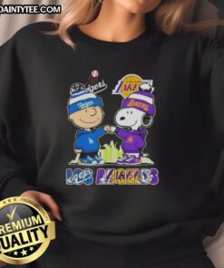 Awesome Charlie Brown fist bump with Snoopy in Los Angeles skyline sweatshirt featuring Dodgers and Lakers logos.