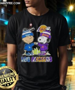 Awesome Charlie Brown fist bump with Snoopy against Los Angeles skyline, showcasing Dodgers and Lakers sports T-shirt.