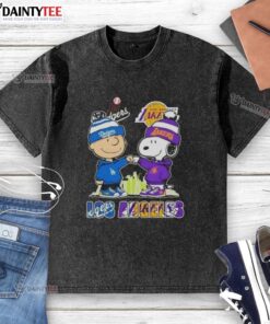 Awesome Charlie Brown fist bump with Snoopy, featuring Los Angeles skyline and Dodgers & Lakers sports theme on washed t-shirt.