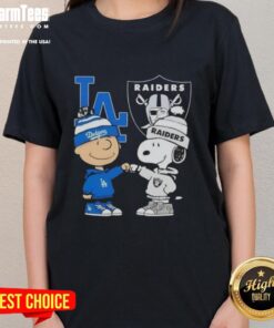 Alt Text: Awesome Charlie Brown fist bump with Snoopy, celebrating Los Angeles Dodgers and Raiders on a ladies tee.