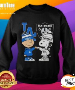 Awesome Charlie Brown fist bump with Snoopy on a Dodgers Raiders sweatshirt in Los Angeles city sports style.