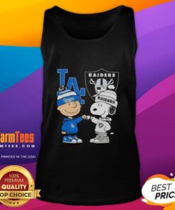 Alt Text: Awesome Charlie Brown fist bump with Snoopy, featuring Dodgers and Raiders tank top in Los Angeles sports theme.