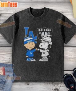 Awesome Charlie Brown fist bump with Snoopy, featuring Los Angeles Dodgers and Raiders on a washed t-shirt design.