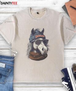 Denver Broncos mascot in a beanie and sunglasses, showcasing team spirit with a washed t-shirt.