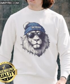 Alt Text: Detroit Lions mascot in a beanie and sunglasses, wearing a sweatshirt, showcasing team spirit and fun.