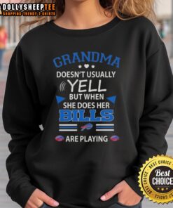 Awesome grandma wearing a Buffalo Bills football sweatshirt, cheering passionately during the game.