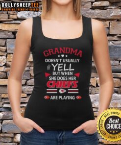 Awesome grandma in a Kansas City Chiefs tank top, cheering passionately during a football game.